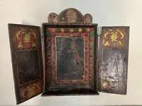 Retablo colonial andino con santo y niño