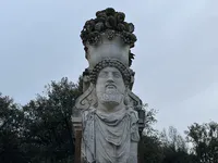 Male Herm Sculpture with Fruit Basket