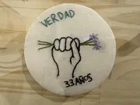 Embroidered Symbol of Justice and Memory