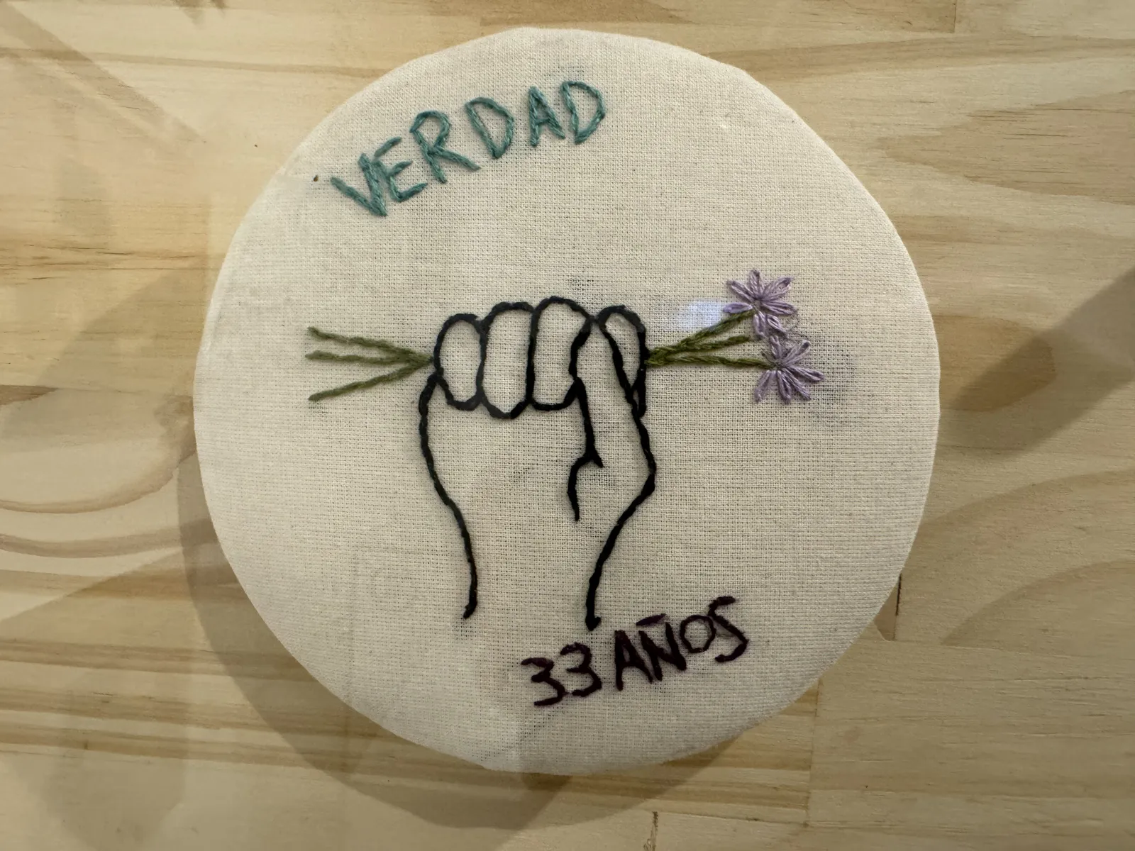 Embroidered Symbol of Justice and Memory