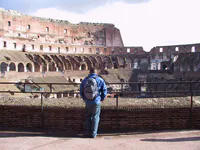 Luis Observing Colosseum Interior
