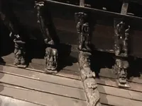 Grotesque Carvings Beneath the Stern