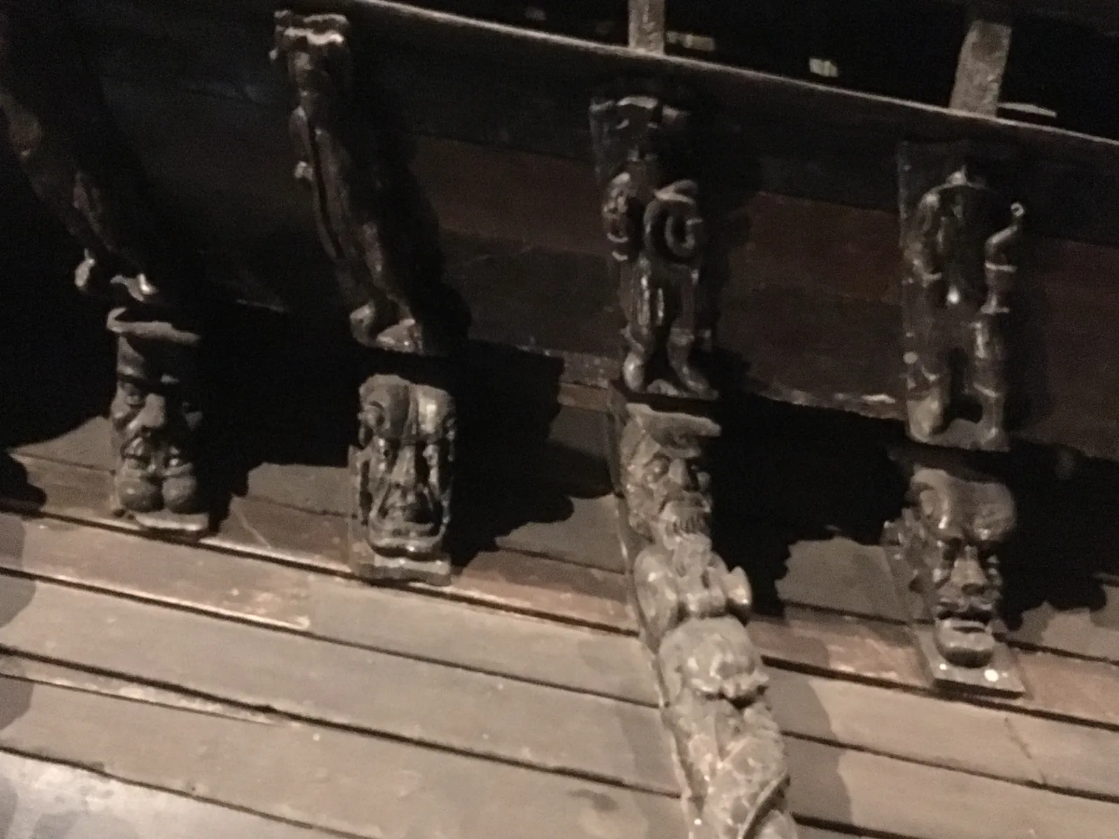 Grotesque Carvings Beneath the Stern
