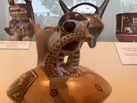 Bottle with Bird Eating Snake Design