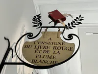 The Red Book and White Feather Sign