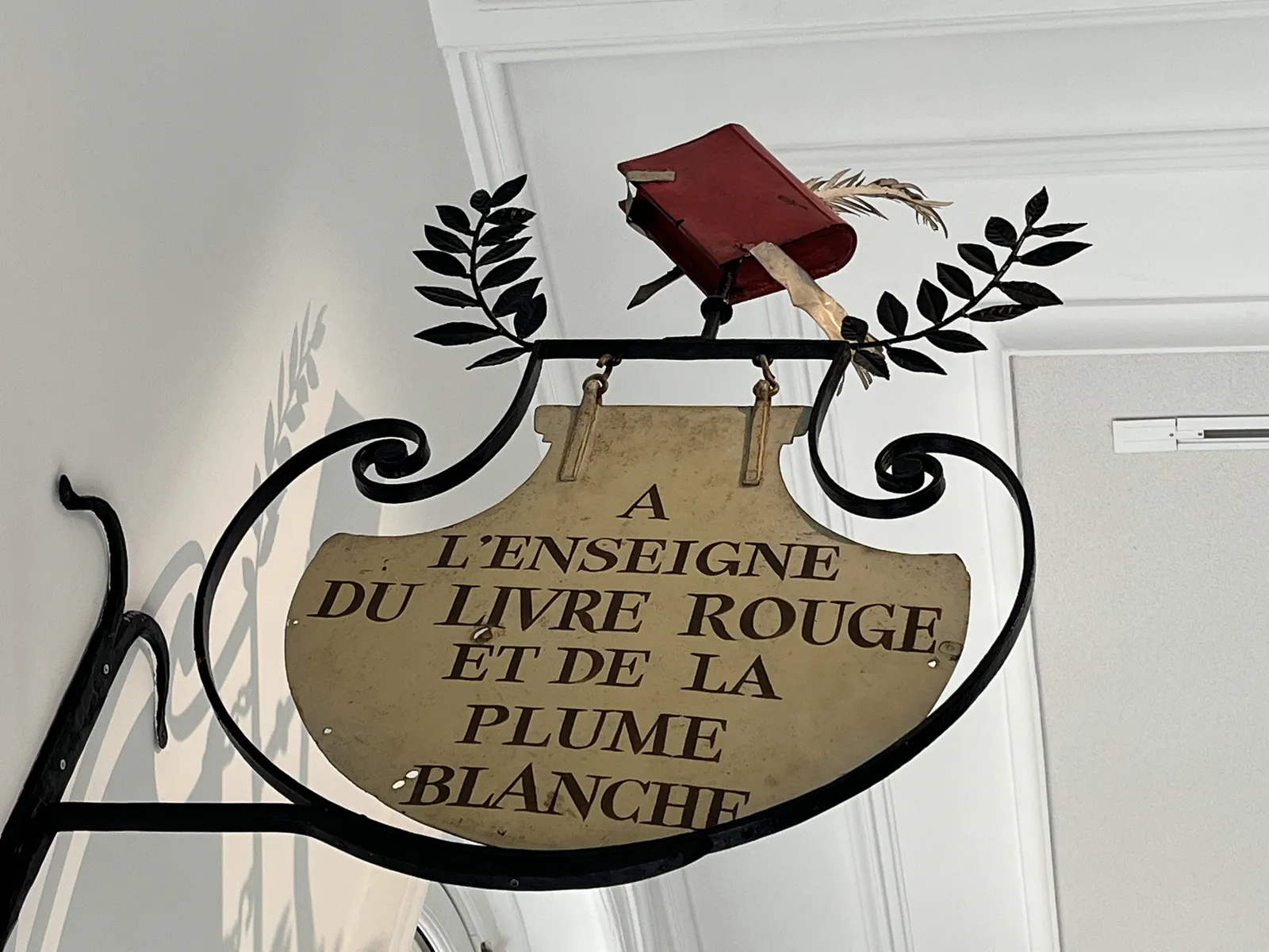 The Red Book and White Feather Sign