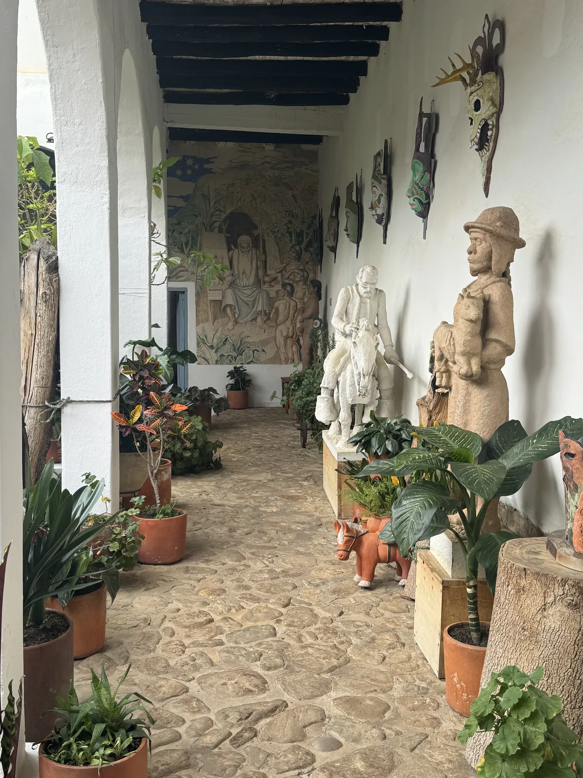 Corridor with Sculptures and Mural